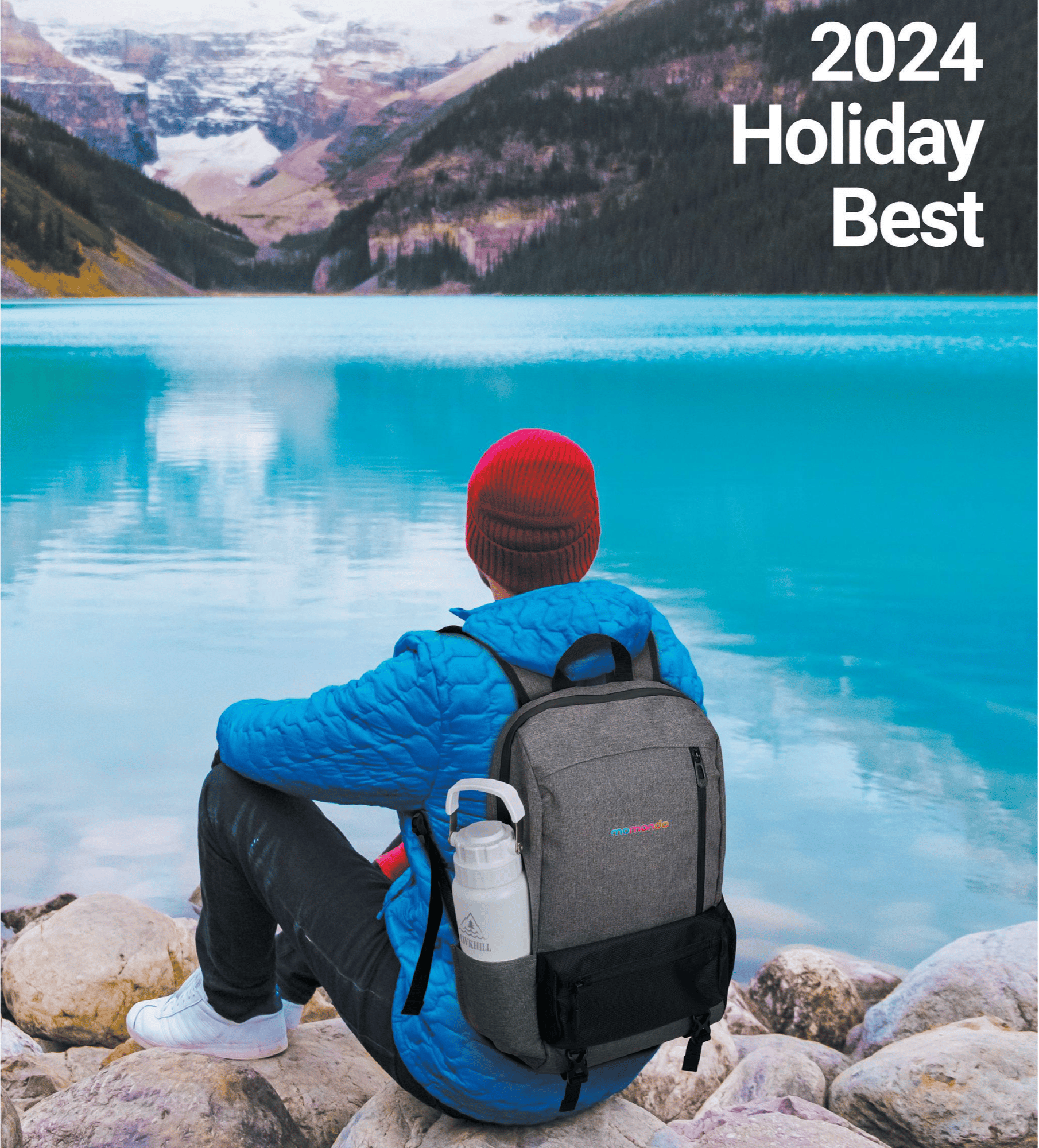 man sitting on rocks by a lake, wearing a beanie, jacket, and backpack holding a water bottle while looking out at a mountain scene scape - QRG 2024 Holiday Best Catalog cover image