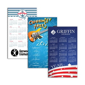 three rectangular magnetic calendars with varying designs and logos